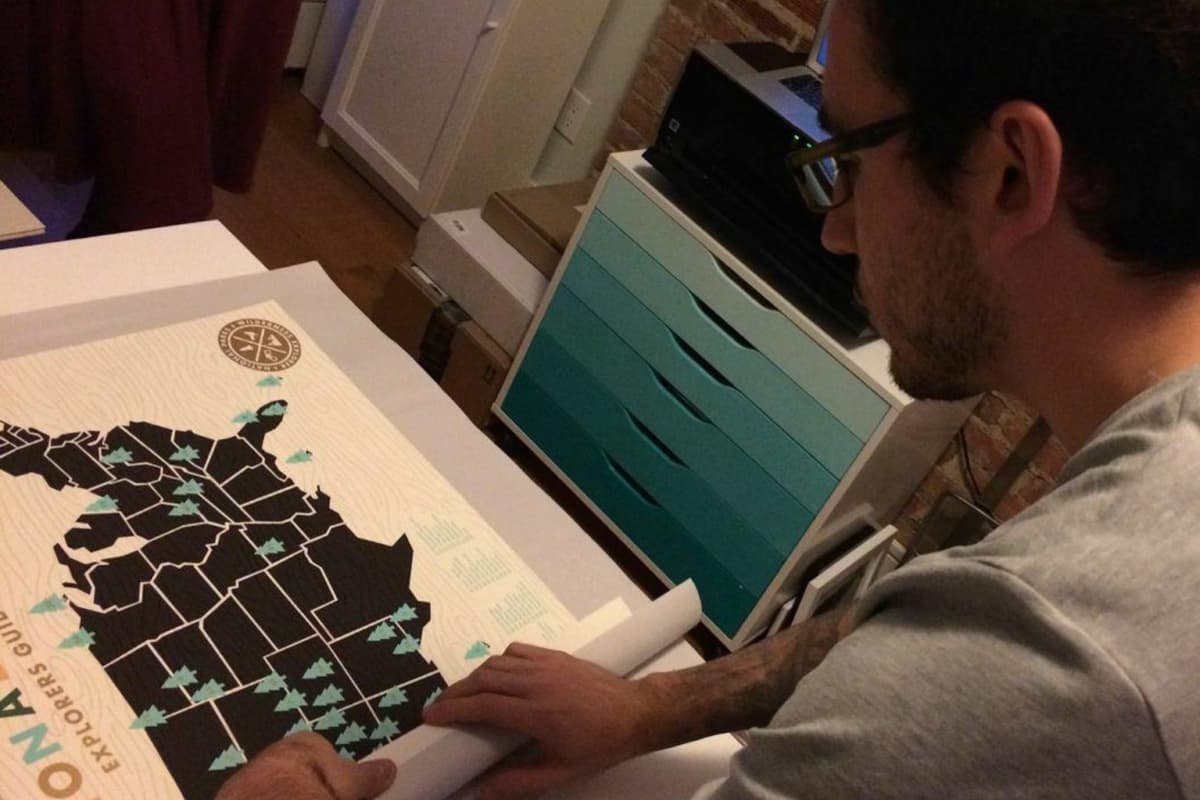 Photo of Aaron helping ship orders at a seller's studio